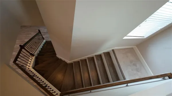 a view of an entryway with wooden floor