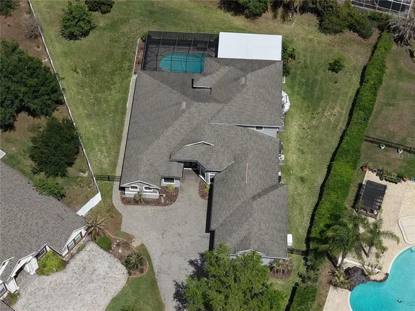 an aerial view of a house with outdoor space