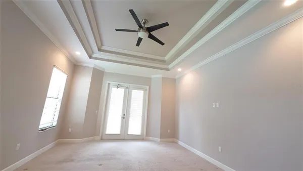 a view of a room with wooden floor and windows