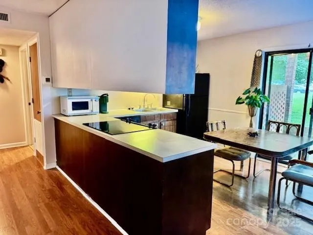 a room with furniture and wooden floor