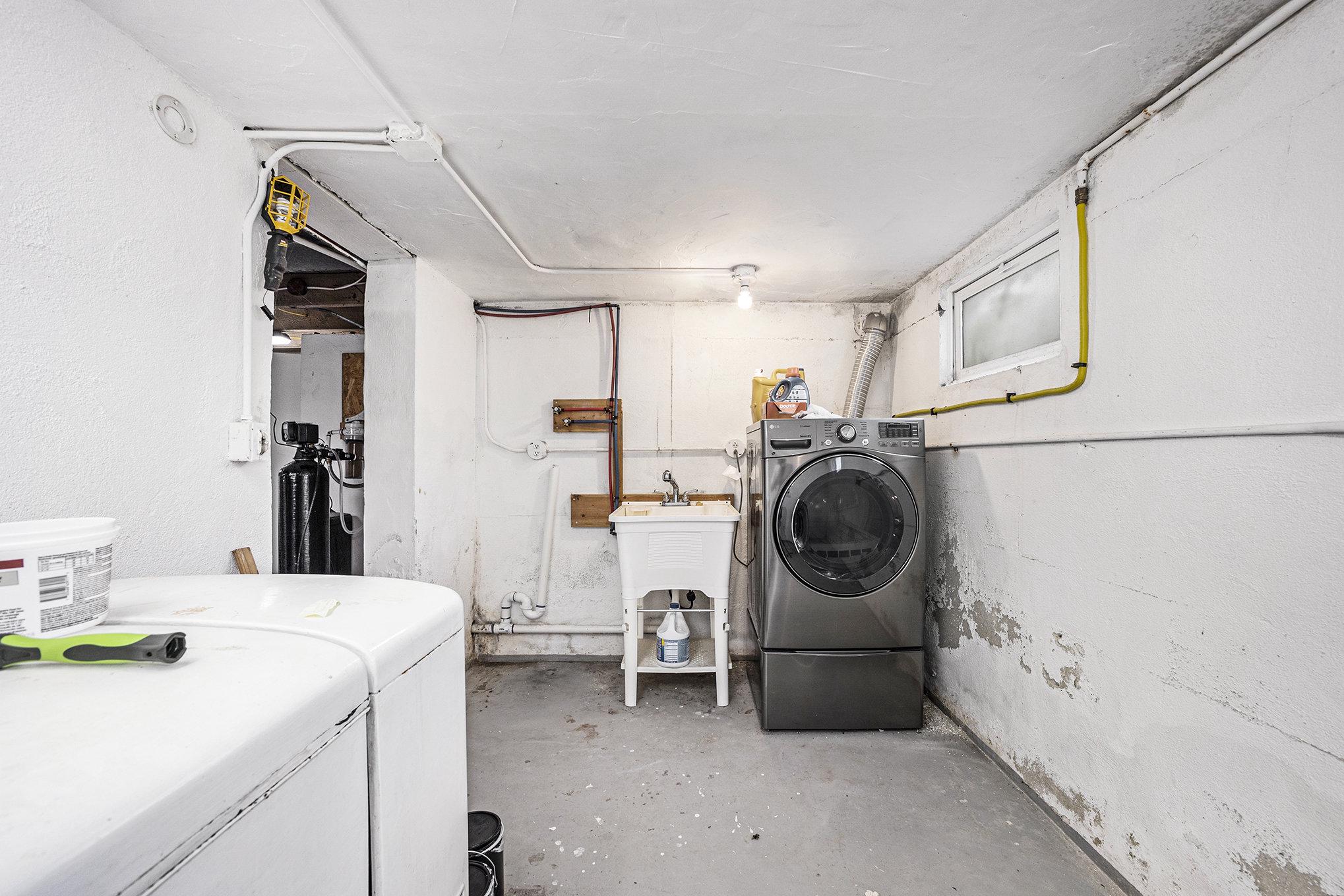 524 Continental Road Hatboro, PA 19040 - Photo 20 of 23 Functional laundry space with utility sink.