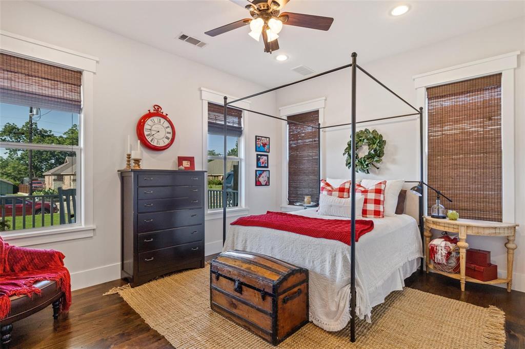 1109 East Oakdale Road Irving, TX 75060 - Photo 19 of 33 a bedroom with a bed mirror and a window