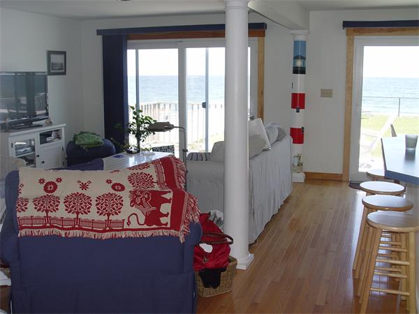 69 Ocean Road North Duxbury, MA 02332 - Photo 11 of 15 a living room with furniture and a large window