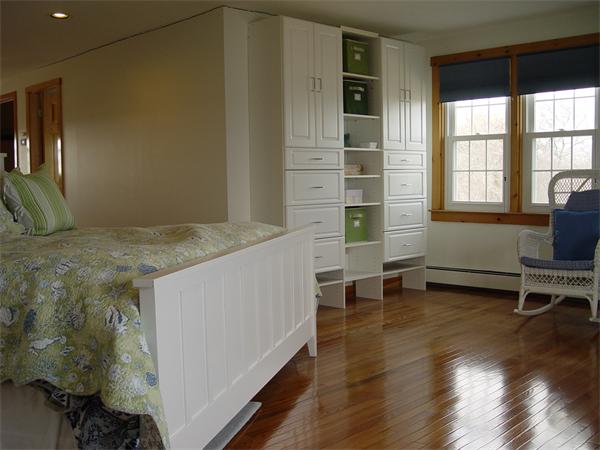 69 Ocean Road North Duxbury, MA 02332 - Photo 13 of 15 a view of a bedroom with wooden floor and a window