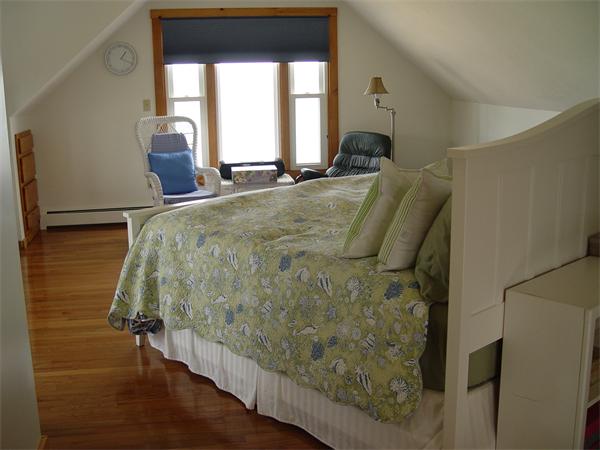 69 Ocean Road North Duxbury, MA 02332 - Photo 14 of 15 a bed sitting in a bedroom next to a window