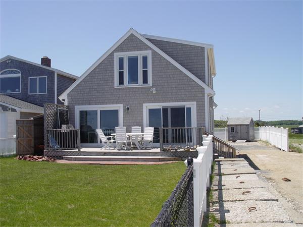 69 Ocean Road North Duxbury, MA 02332 - Photo 3 of 15 a front view of house with yard outdoor seating and barbeque oven