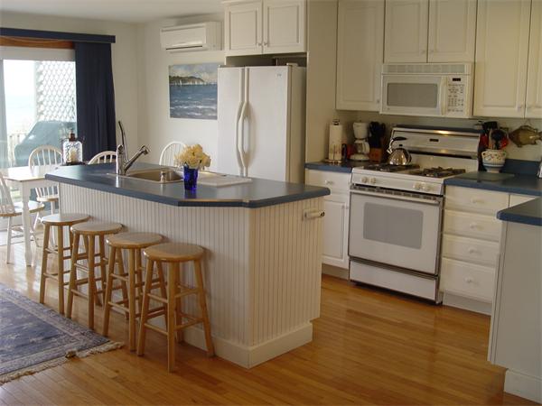 69 Ocean Road North Duxbury, MA 02332 - Photo 8 of 15 a kitchen with stainless steel appliances granite countertop a stove a sink and a refrigerator