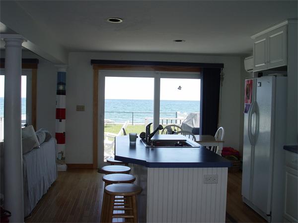 69 Ocean Road North Duxbury, MA 02332 - Photo 10 of 15 a dining room with furniture and a floor to ceiling window