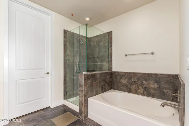 a bathroom with double sink and a mirror