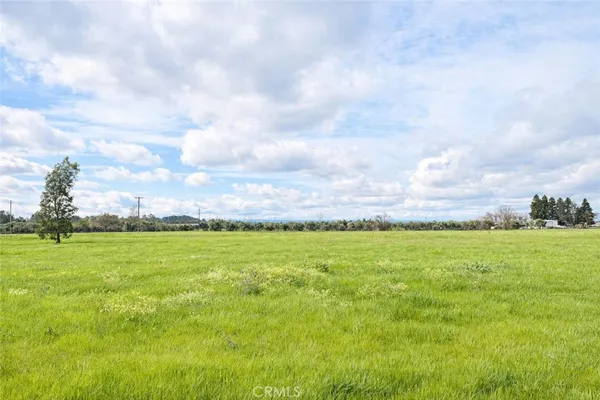 a view of an ocean and a yard