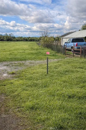 a view of a field with sitting area