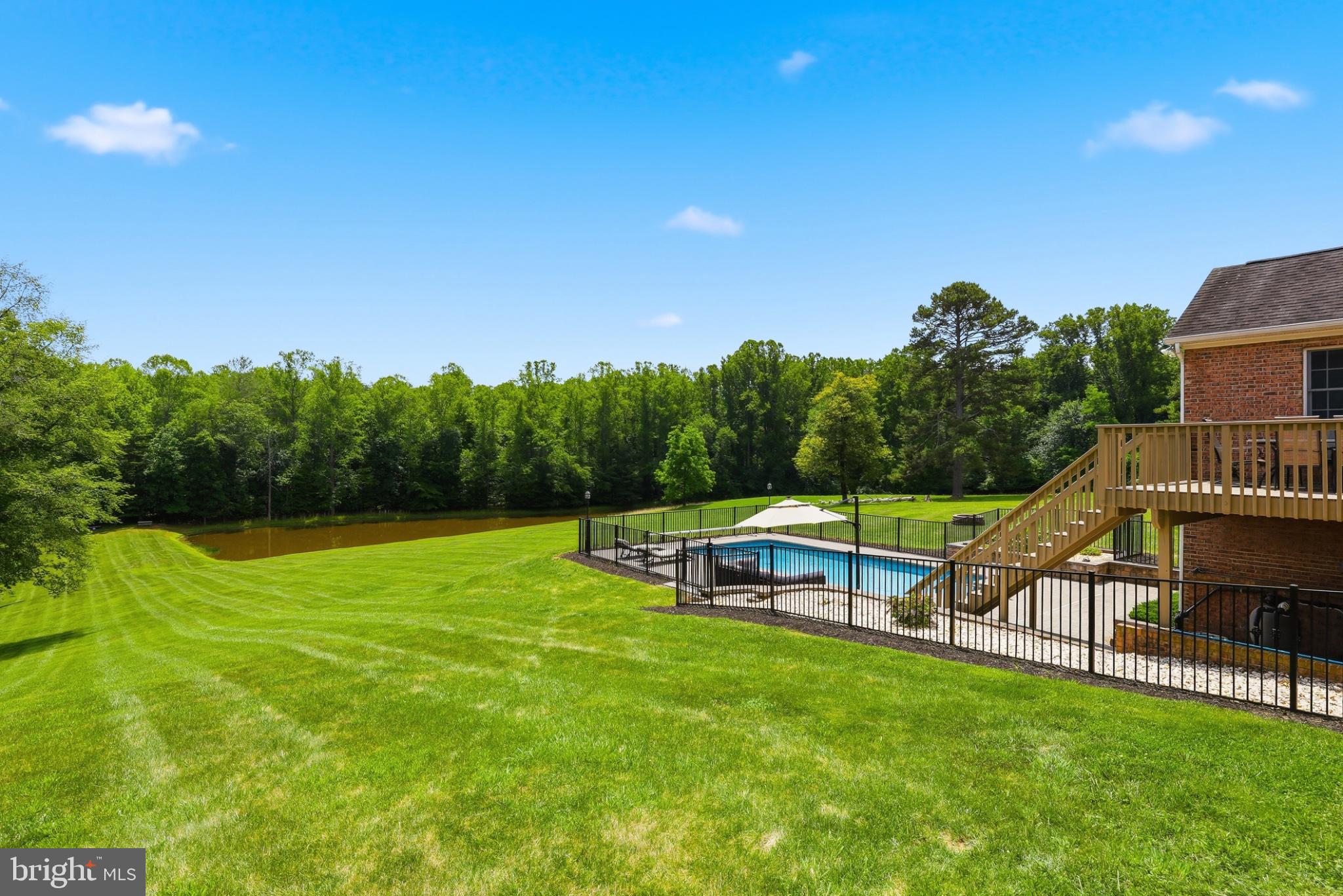 11337 Old Stillhouse Road Boston, VA 22713 - Photo 58 of 58 a view of a swimming pool with lawn chairs and a big yard