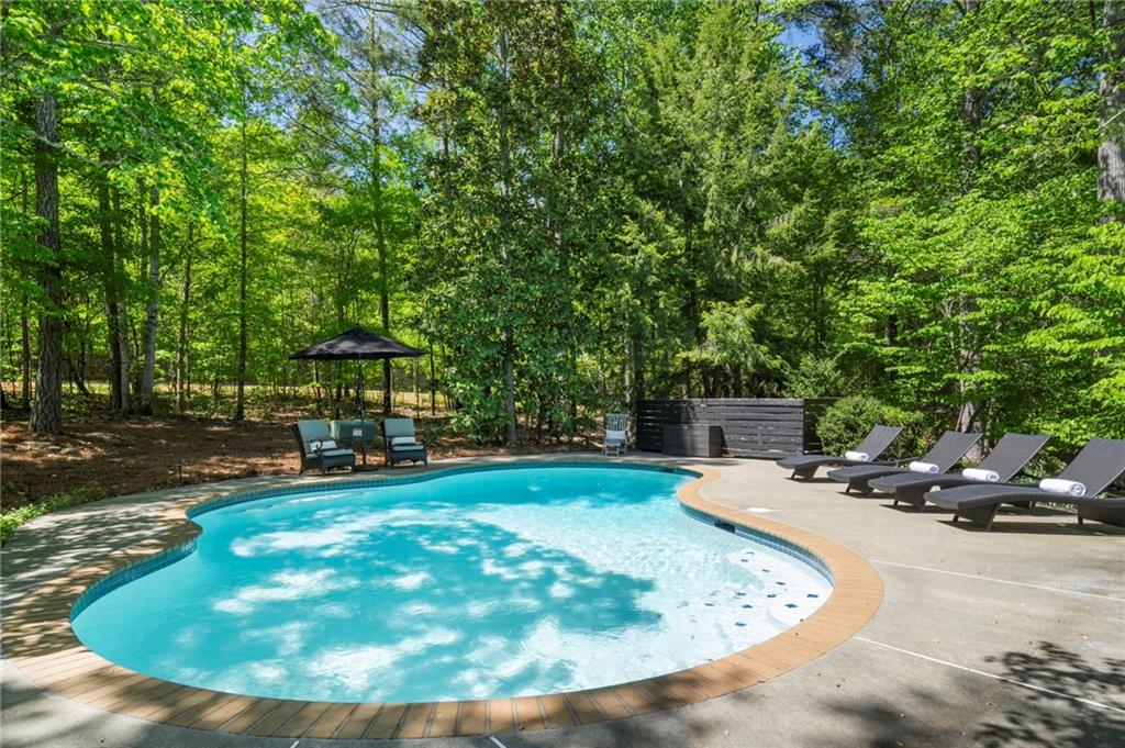 1550 Lackey Road Roswell, GA 30075 - Photo 37 of 92 a view of a swimming pool with a patio
