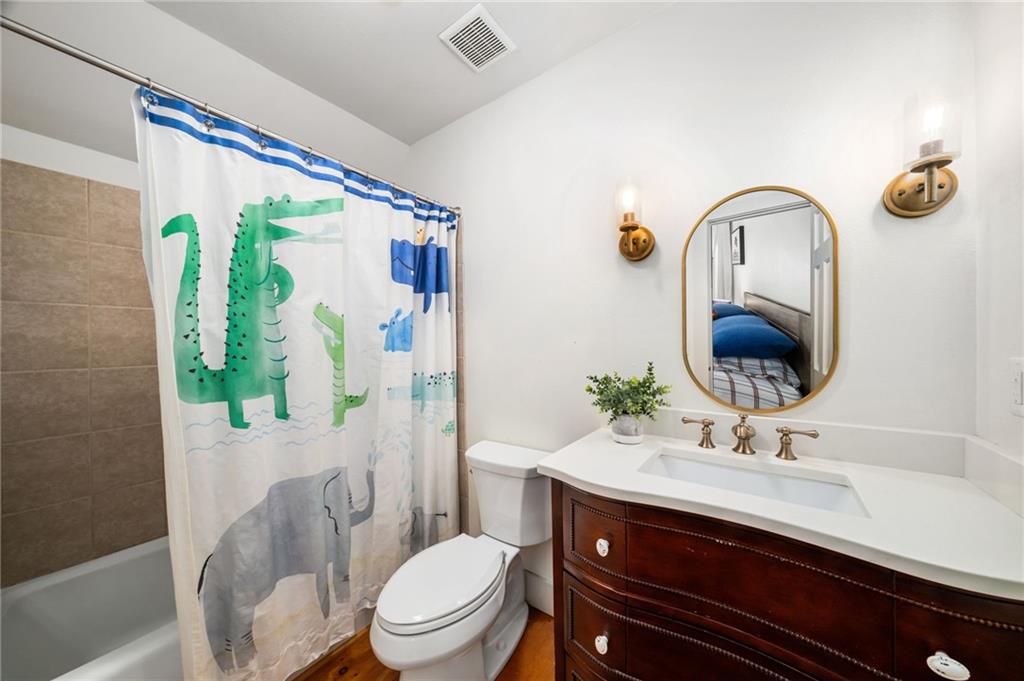 1550 Lackey Road Roswell, GA 30075 - Photo 53 of 92 a bathroom with a sink vanity mirror and toilet