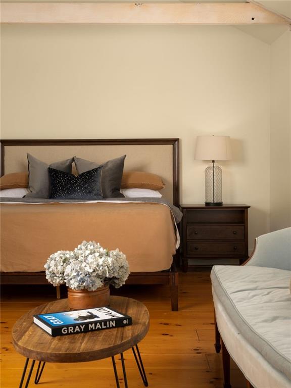 1550 Lackey Road Roswell, GA 30075 - Photo 58 of 92 a bed sitting in a bedroom next to a lamp with a rug