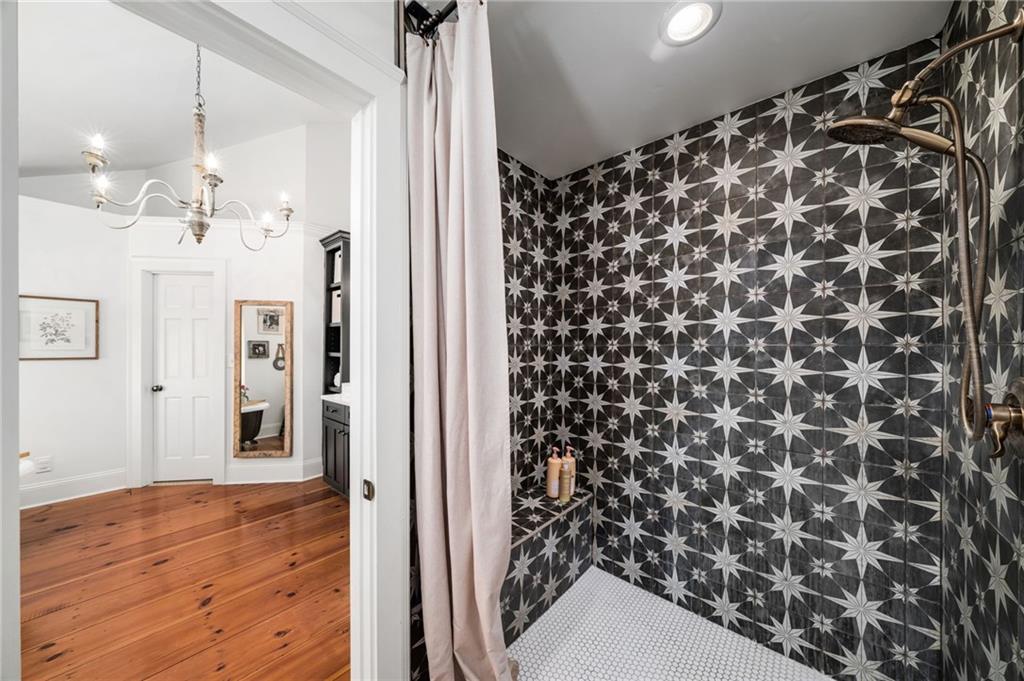 1550 Lackey Road Roswell, GA 30075 - Photo 65 of 92 a view of a bathroom with a shower curtain