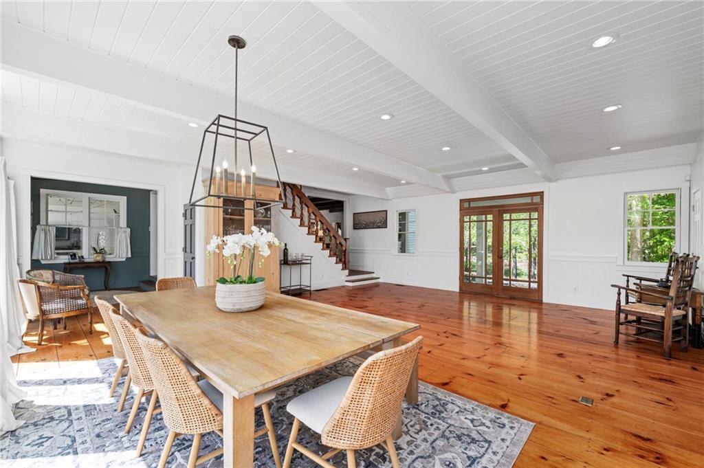 1550 Lackey Road Roswell, GA 30075 - Photo 68 of 92 a view of a dining room and livingroom with furniture wooden floor a chandelier