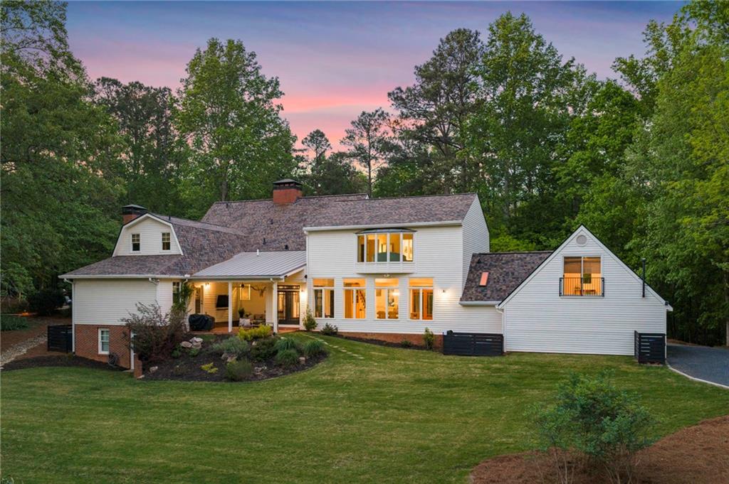 1550 Lackey Road Roswell, GA 30075 - Photo 75 of 92 a front view of a house with a garden