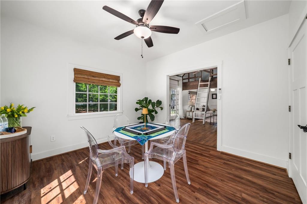 1550 Lackey Road Roswell, GA 30075 - Photo 83 of 92 a view of a dining room with furniture window and wooden floor