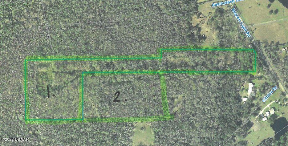 0 Beacon Light Road Edgewater, FL 32141 - Photo 1 of 2 a backyard of a house with lots of green space