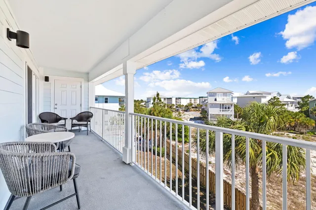 a view of a balcony with furniture