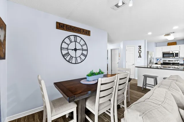 a view of a dining room with furniture