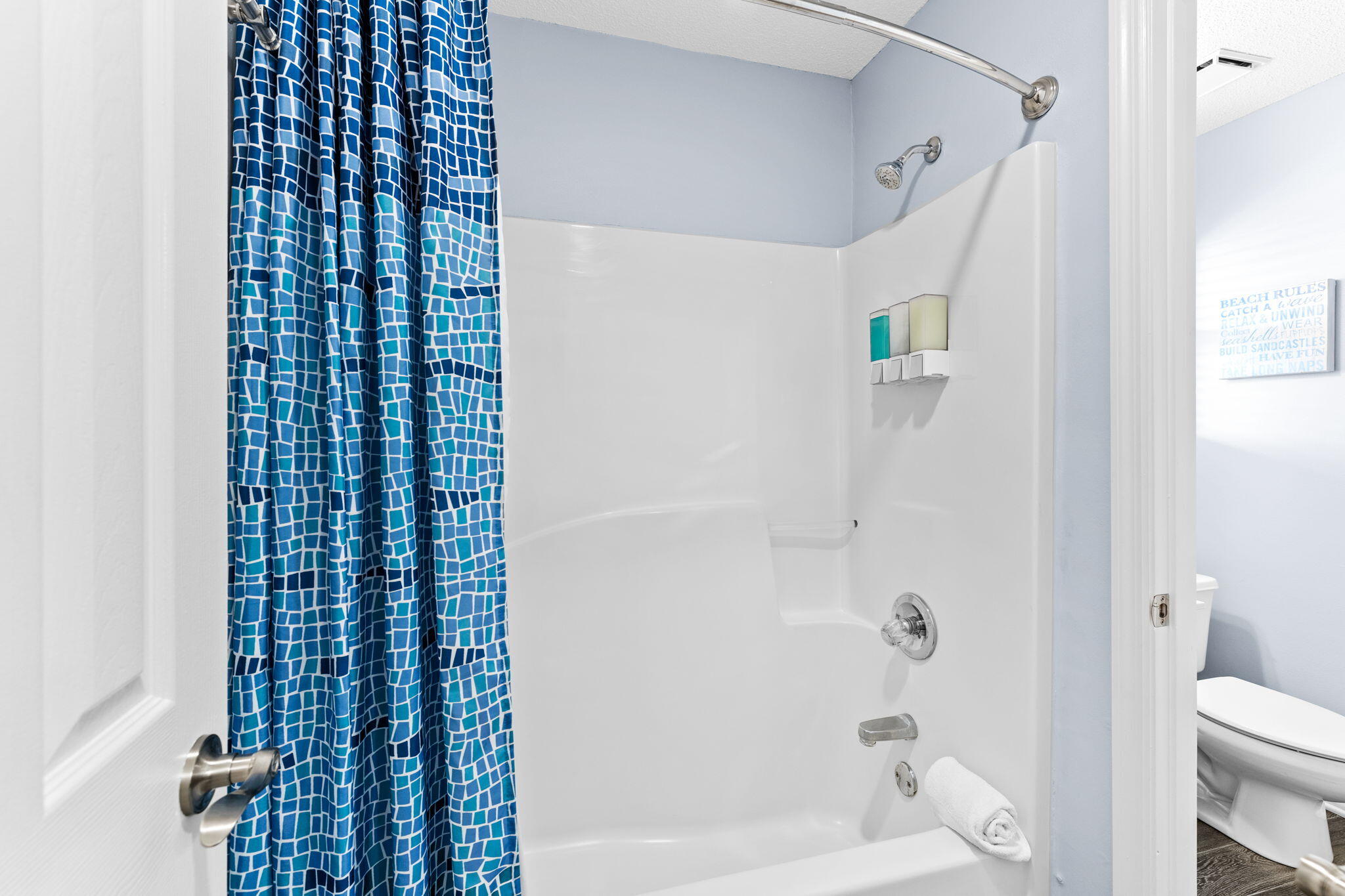 11 Beachside Drive, Unit 1132 Santa Rosa Beach, FL 32459 - Photo 9 of 15 a bathroom with a shower curtain and a toilet