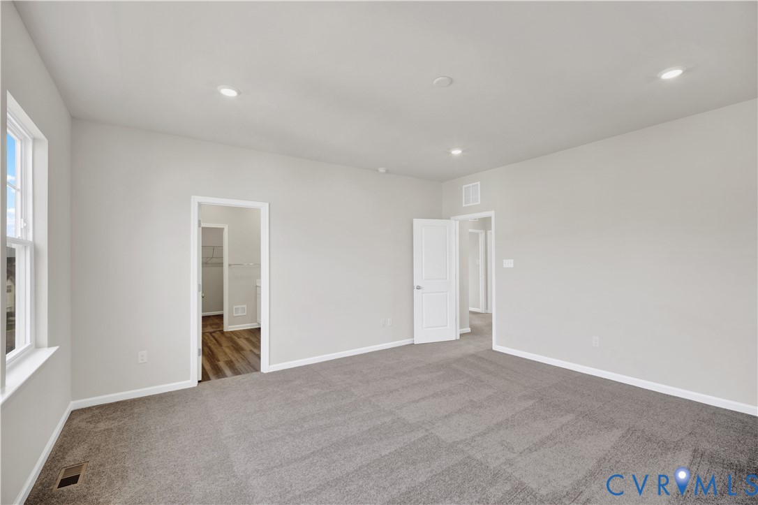 6612 Cassia Loop Moseley, VA 23120 - Photo 13 of 19 a view of livingroom with an empty space and a window