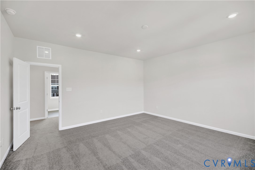 6612 Cassia Loop Moseley, VA 23120 - Photo 17 of 19 wooden floor in an empty room with a window