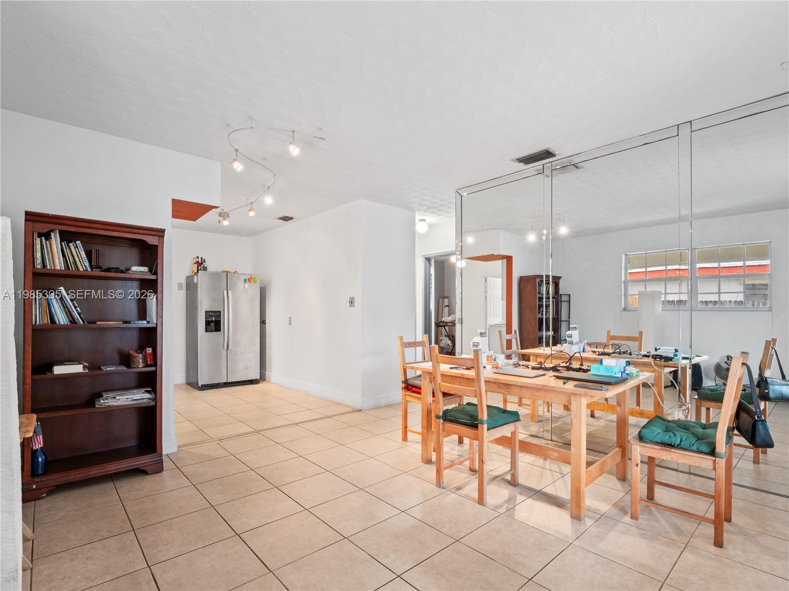6111 Southwest 20th Court Miramar, FL 33023 - Photo 12 of 31 a large kitchen with a table and chairs