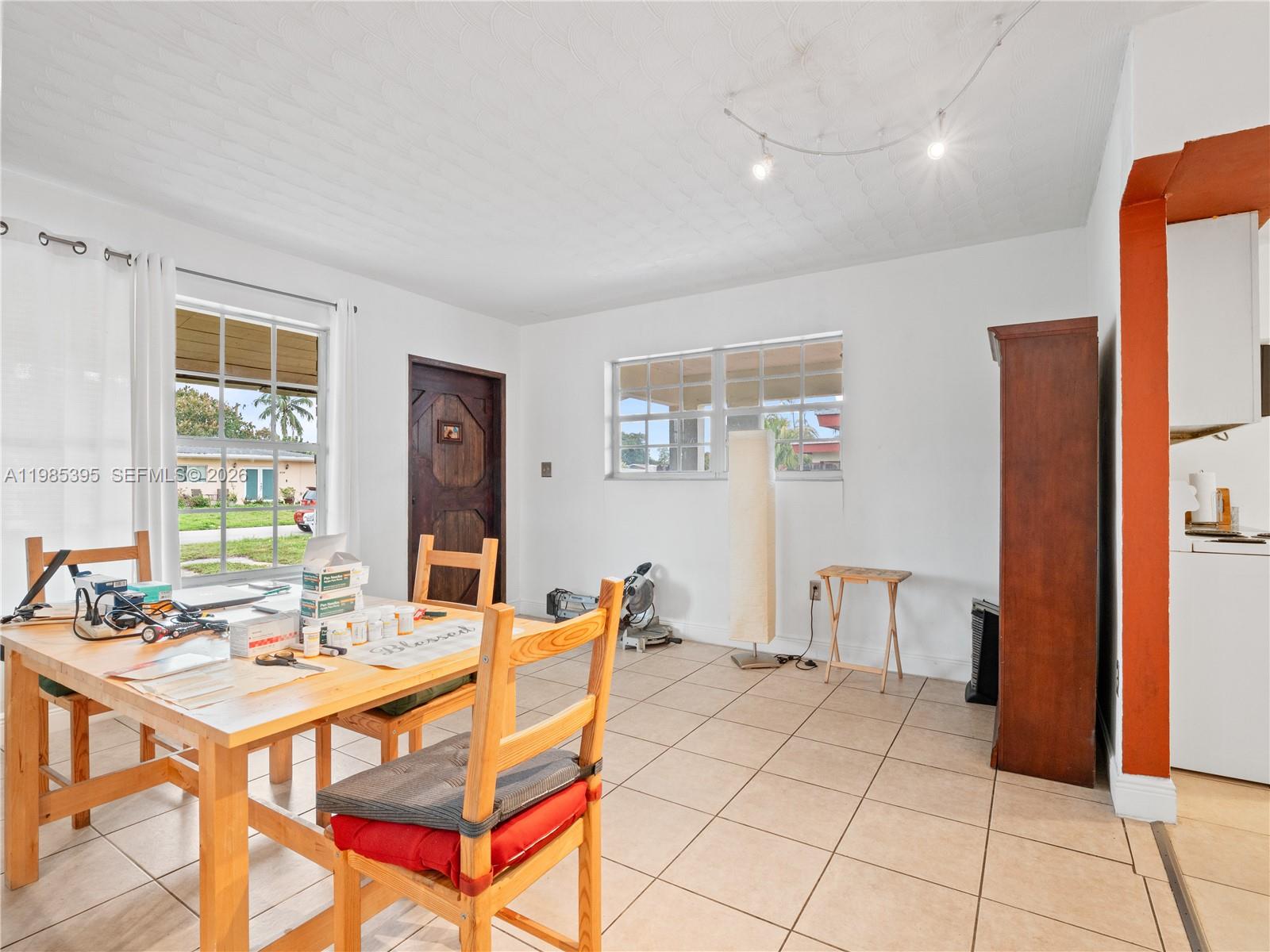 6111 Southwest 20th Court Miramar, FL 33023 - Photo 13 of 31 a view of a dining room with furniture