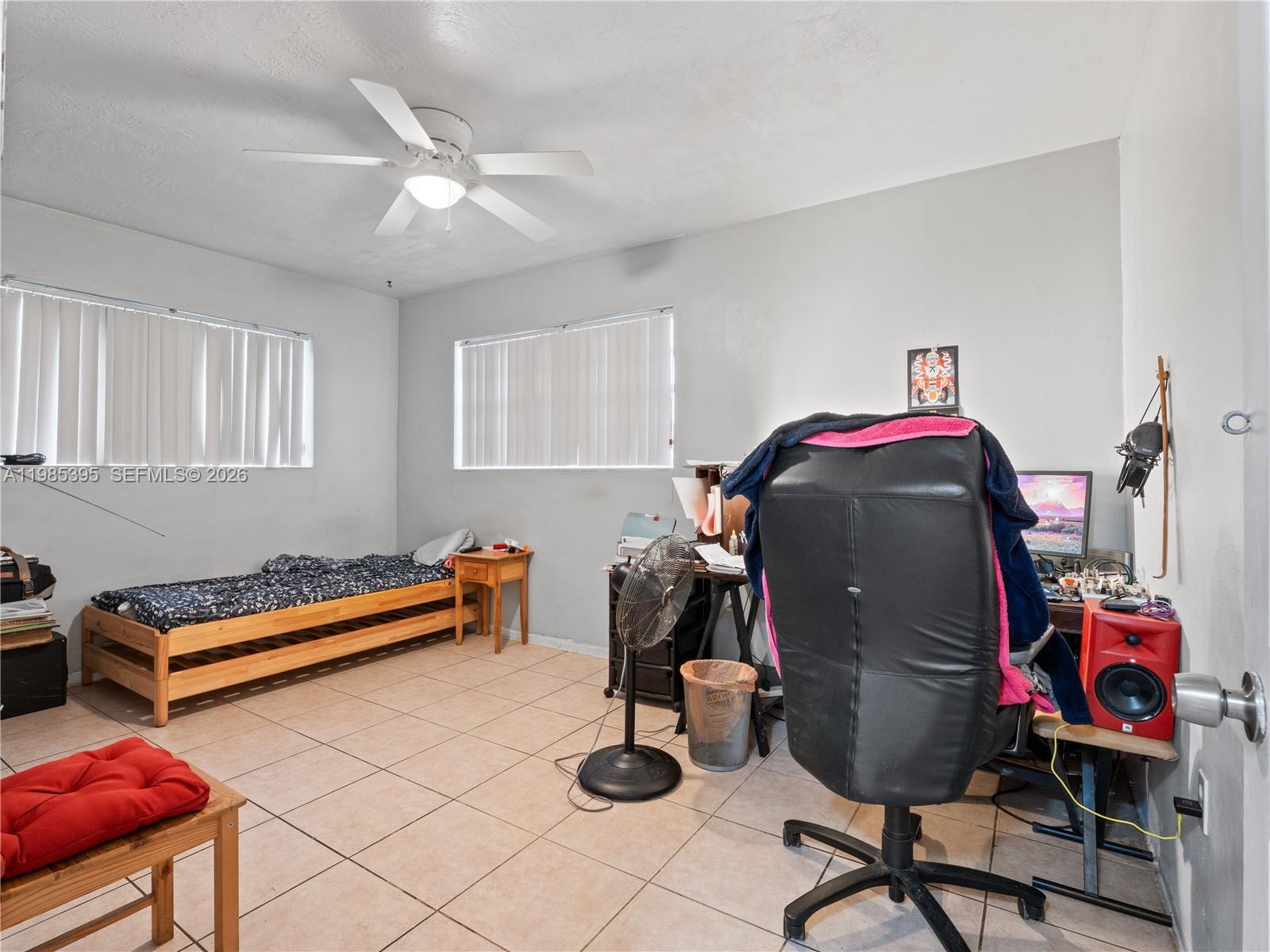 6111 Southwest 20th Court Miramar, FL 33023 - Photo 15 of 31 a room with furniture and gym equipment