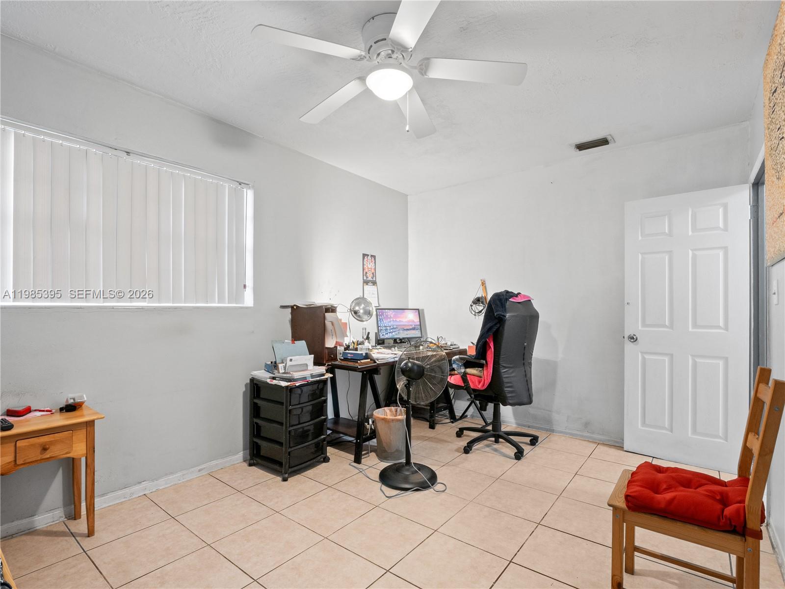 6111 Southwest 20th Court Miramar, FL 33023 - Photo 20 of 31 a room with gym equipment and equipment