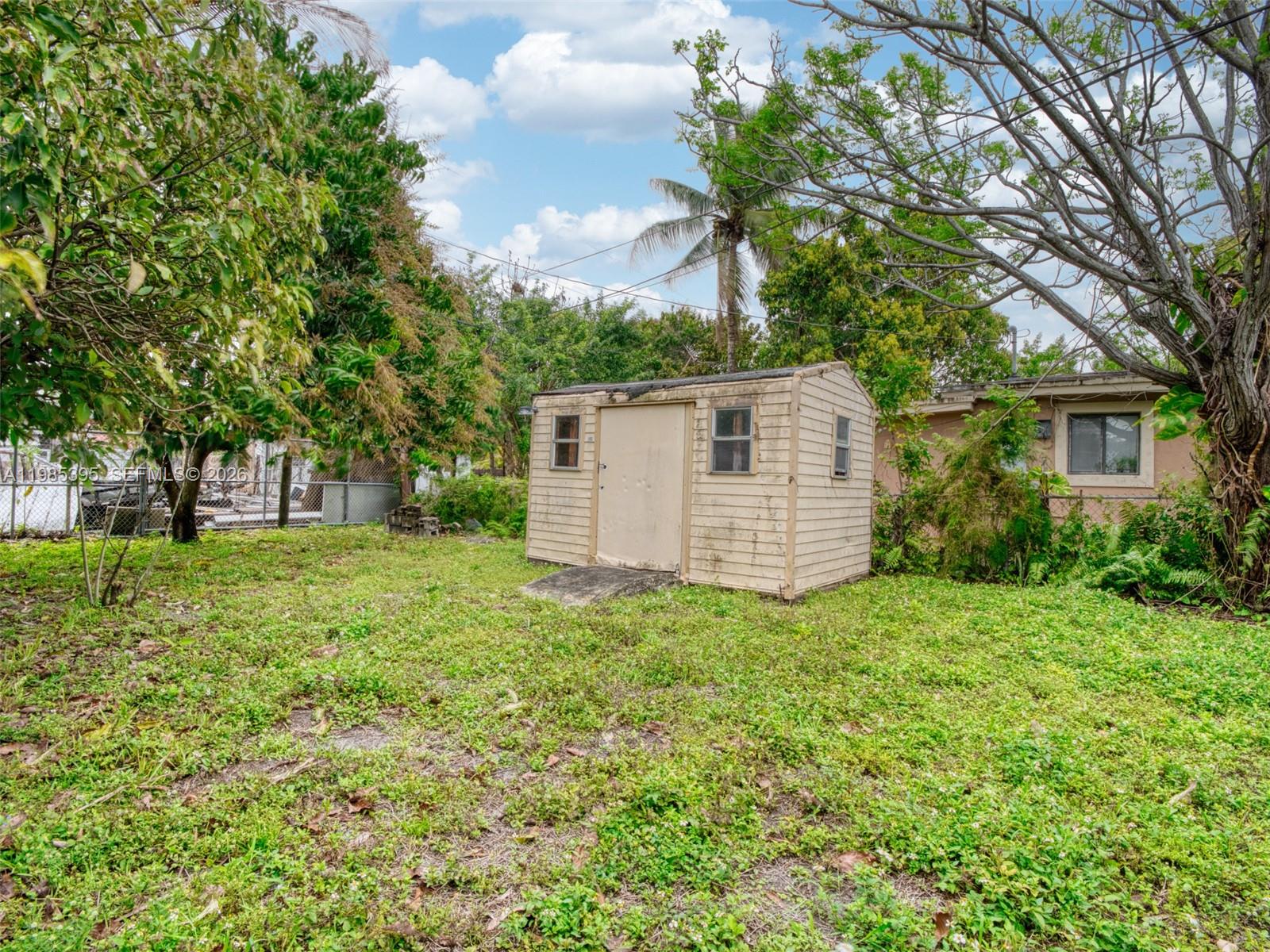 6111 Southwest 20th Court Miramar, FL 33023 - Photo 26 of 31 a view of a house with backyard and garden