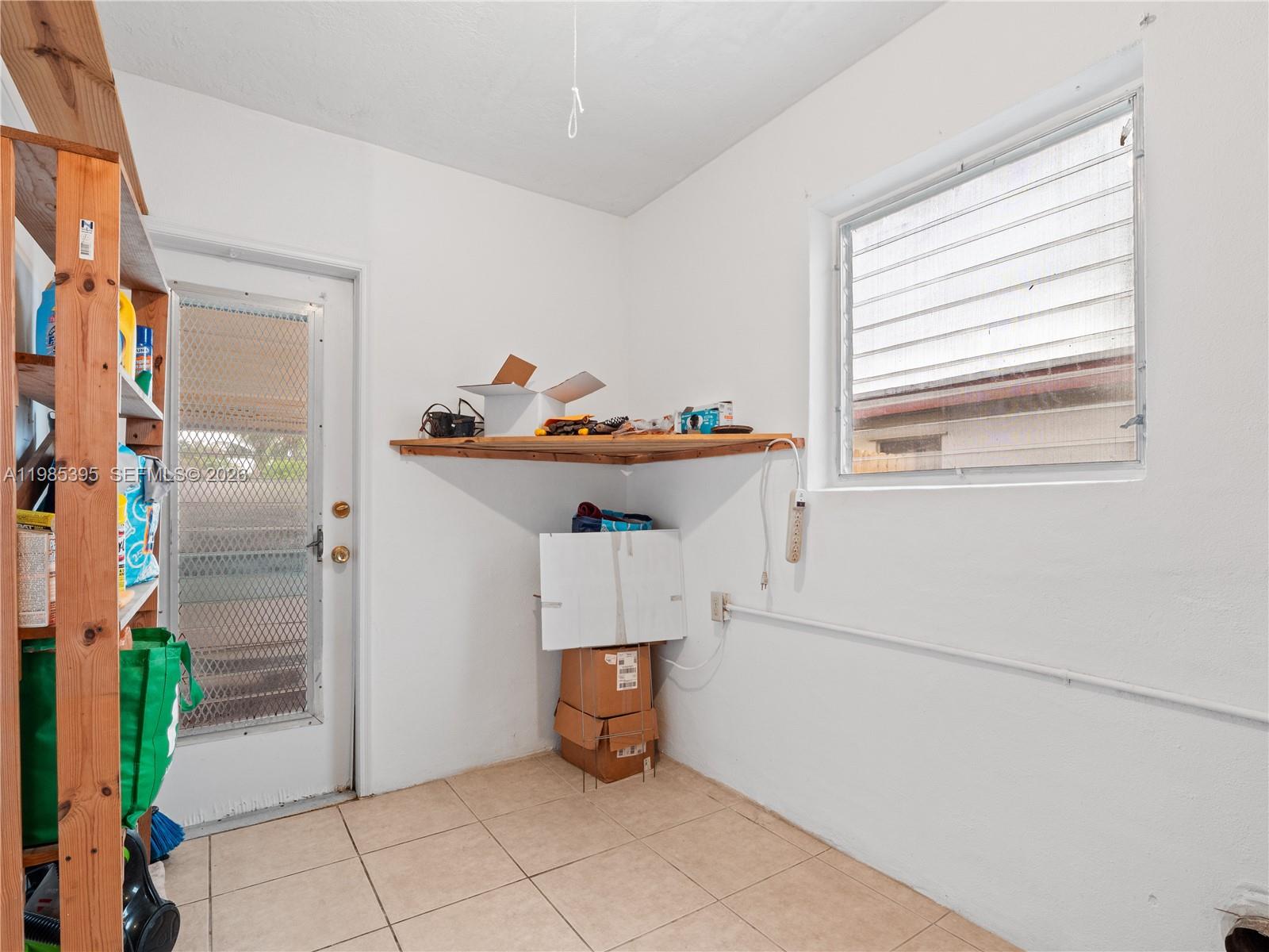 6111 Southwest 20th Court Miramar, FL 33023 - Photo 8 of 31 a room with storage and utility