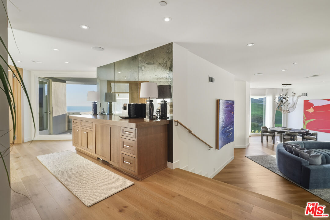 3140 Sweetwater Mesa Road Malibu, CA 90265 - Photo 35 of 71 a kitchen with stainless steel appliances a refrigerator and a stove top oven