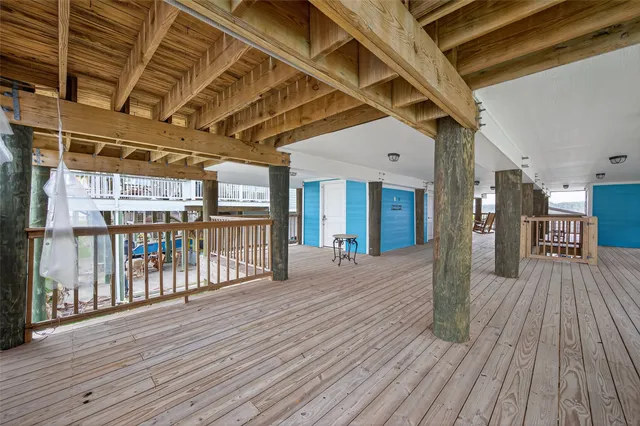 a view of a hall with wooden floor