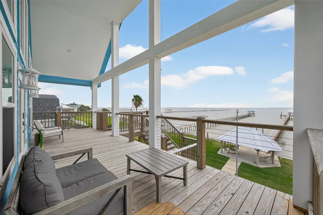 a view of a balcony with wooden floor