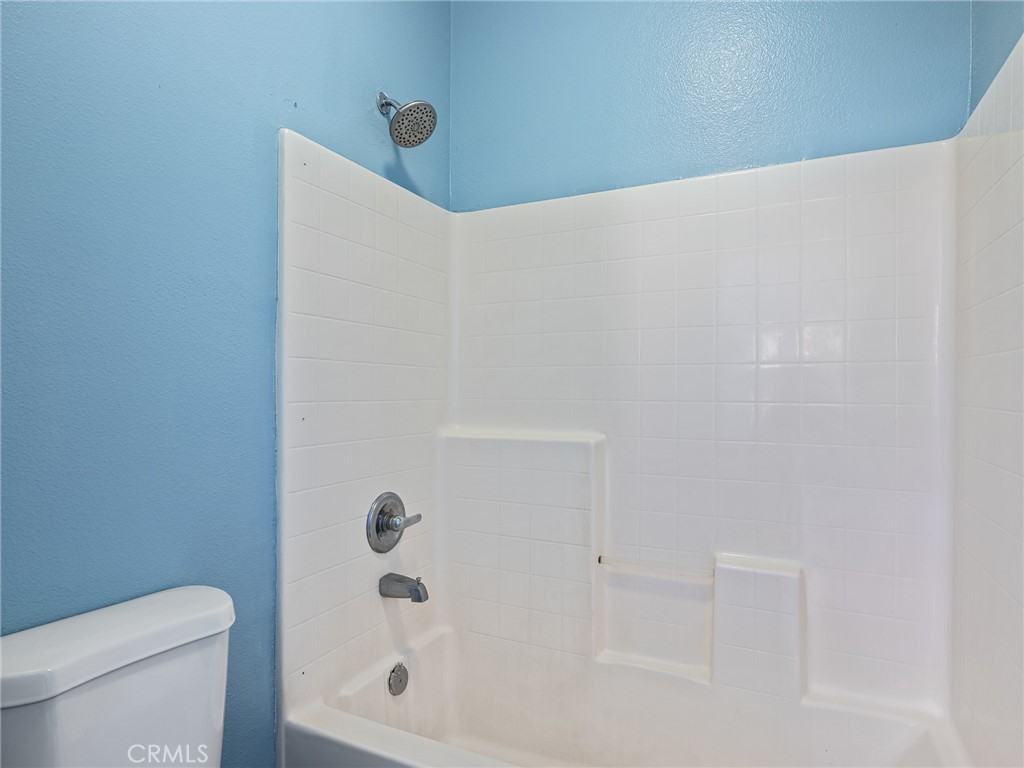 14400 Jeremiah Street Adelanto, CA 92301 - Photo 15 of 45 a bathroom with a bathtub
