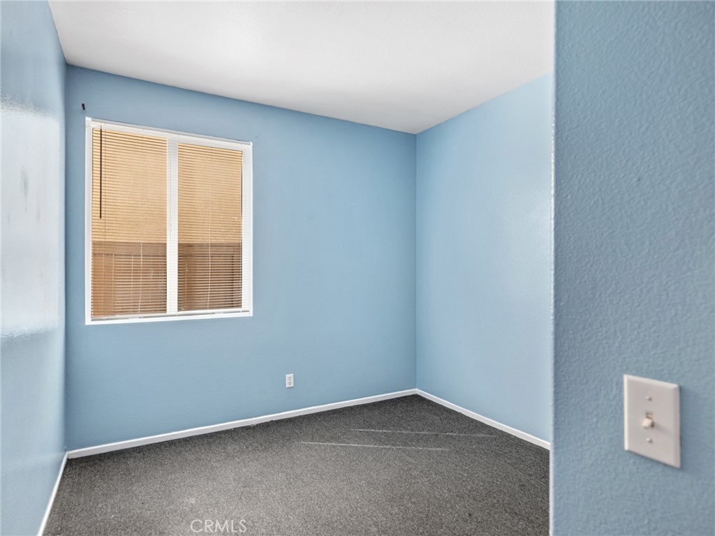 14400 Jeremiah Street Adelanto, CA 92301 - Photo 16 of 45 an empty room with a window