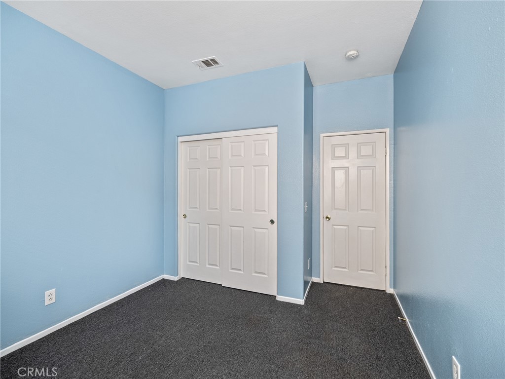 14400 Jeremiah Street Adelanto, CA 92301 - Photo 19 of 45 a view of an empty room and closet area