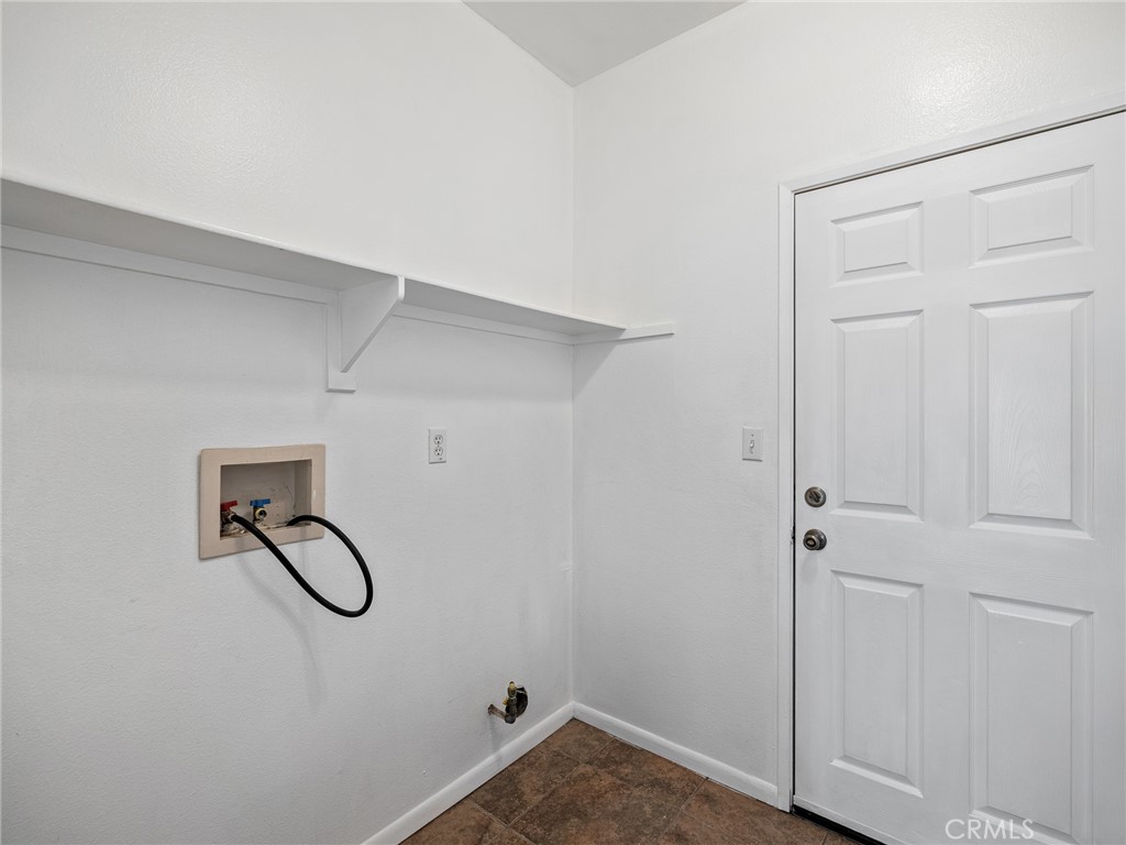 14400 Jeremiah Street Adelanto, CA 92301 - Photo 22 of 45 a view of a storage & utility room with racks on the wall