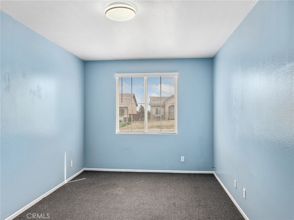 14400 Jeremiah Street Adelanto, CA 92301 - Photo 24 of 45 an empty room with a window