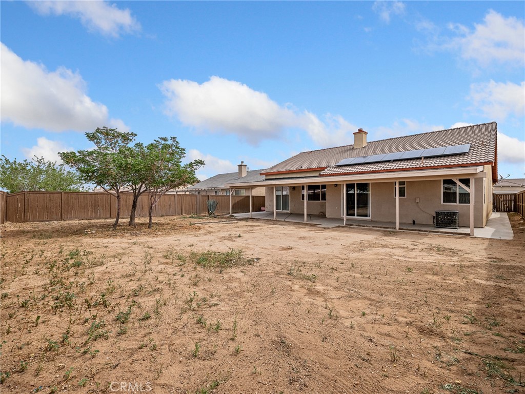 14400 Jeremiah Street Adelanto, CA 92301 - Photo 34 of 45 a front view of a house with a yard