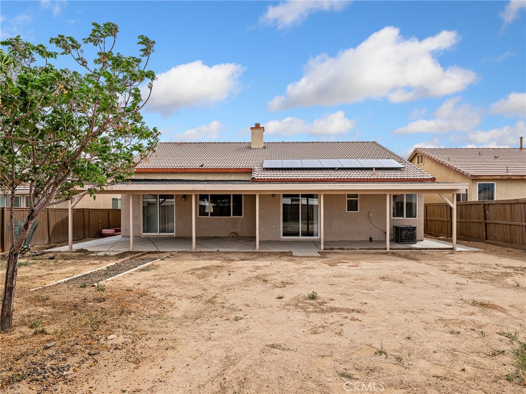 14400 Jeremiah Street Adelanto, CA 92301 - Photo 35 of 45 a front view of a house with a yard