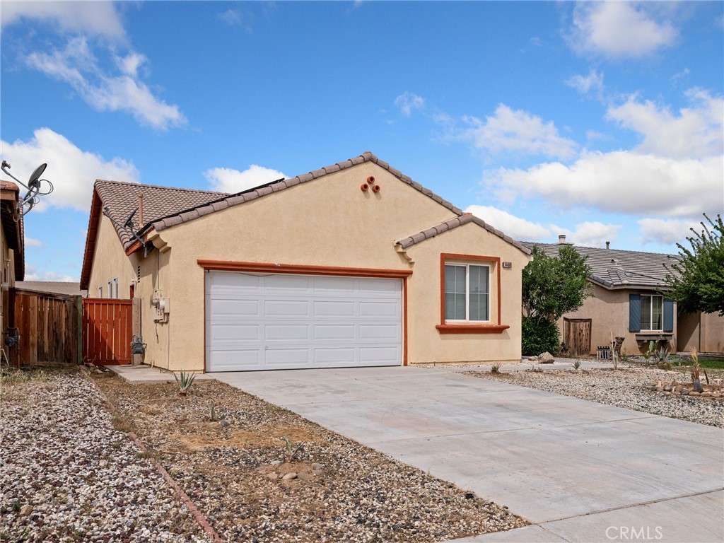 14400 Jeremiah Street Adelanto, CA 92301 - Photo 40 of 45 a view of a house with a backyard