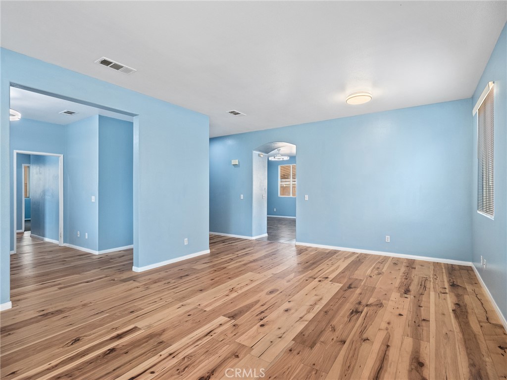 14400 Jeremiah Street Adelanto, CA 92301 - Photo 4 of 45 a view of empty room with wooden floor