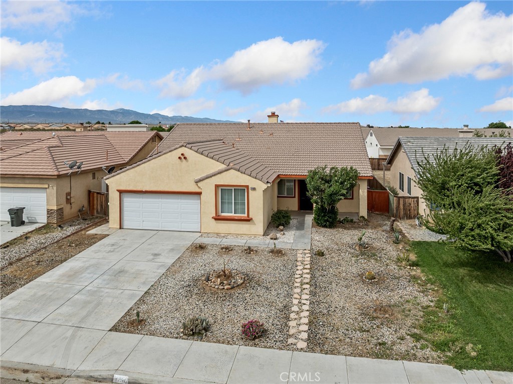 14400 Jeremiah Street Adelanto, CA 92301 - Photo 41 of 45 front view of a house with a yard