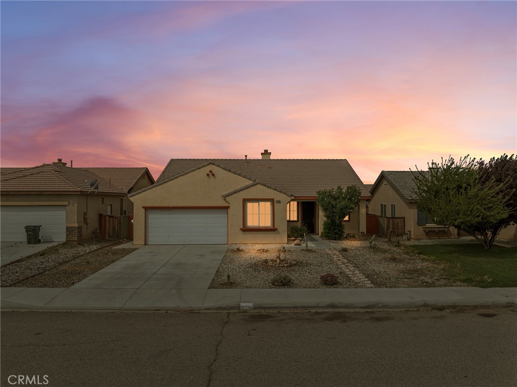 14400 Jeremiah Street Adelanto, CA 92301 - Photo 42 of 45 a front view of a house with a yard
