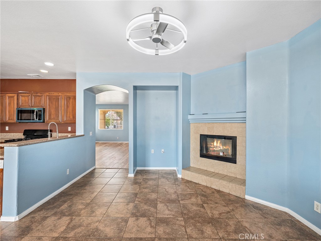 14400 Jeremiah Street Adelanto, CA 92301 - Photo 9 of 45 a view of a kitchen with a sink and a fireplace